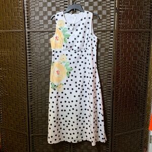 White dress with black polkadots. Large. No tags but never worn.